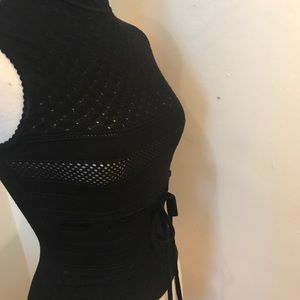 Valentino sleeveless black turtleneck sweater.